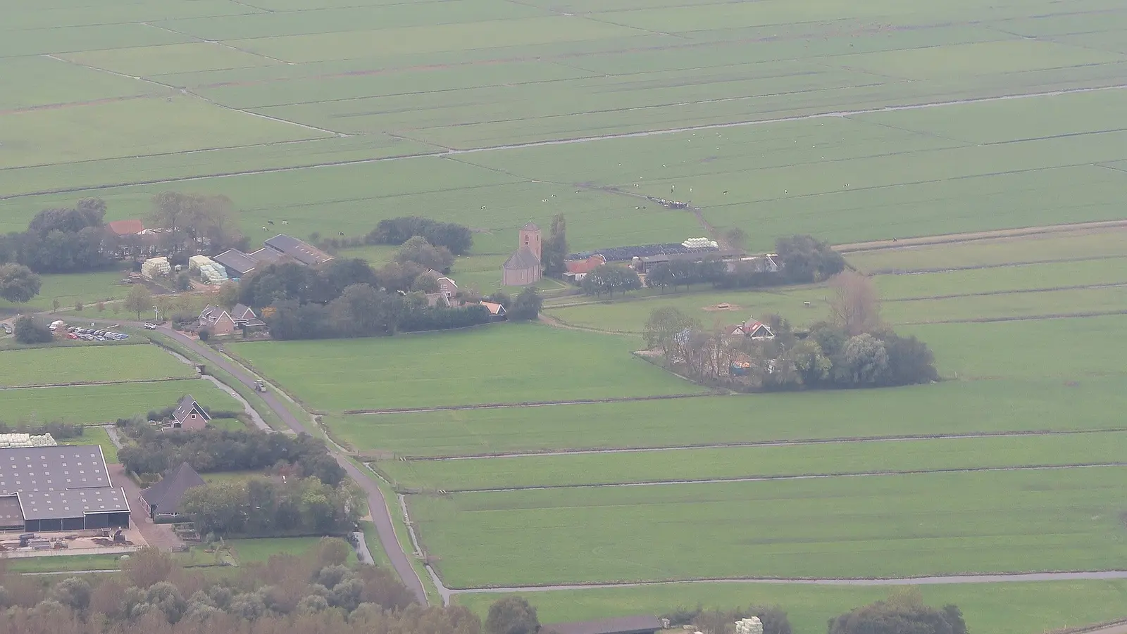 Aerial view of green polder fields and farms around Spaarnwoude near Amsterdam
