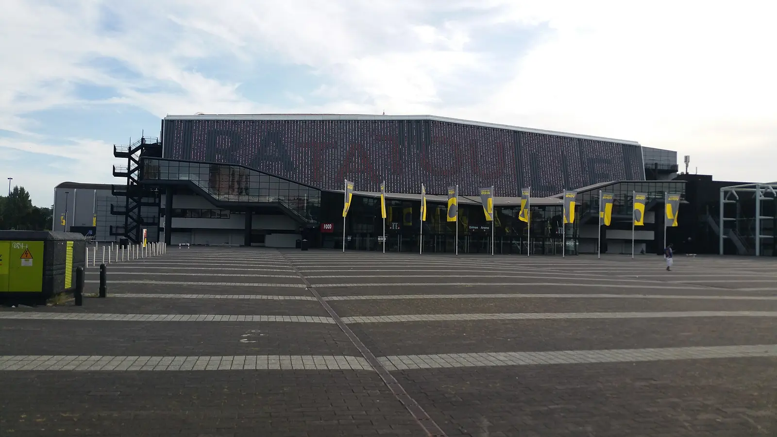 The Rotterdam Ahoy arena building and forecourt with yellow flags